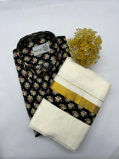 Black and gold patterned shirt with white pants and a yellow flower on a light gray background