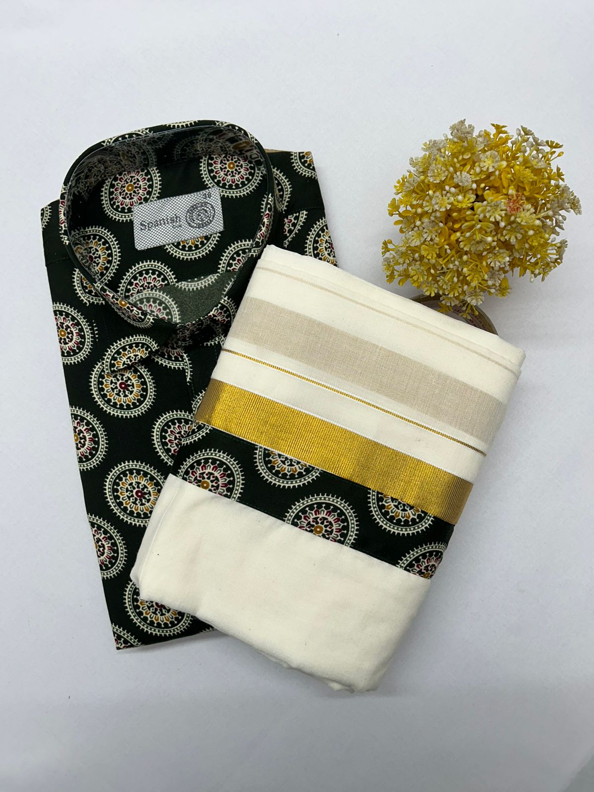 Two fabric swatches, one black with gold patterns and the other beige with gold stripes, on a white background.